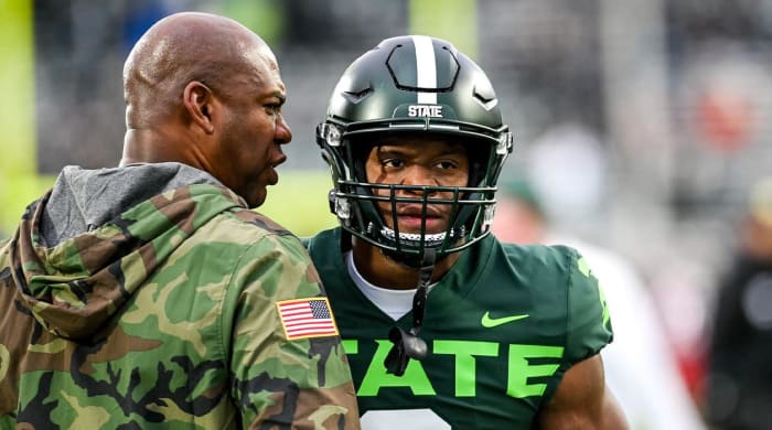 Michigan State head coach Mel Tucker, left, gets Kenneth Walker III fired up before the game against Maryland on Saturday, Nov. 13, 2021, at Spartan Stadium in East Lansing.